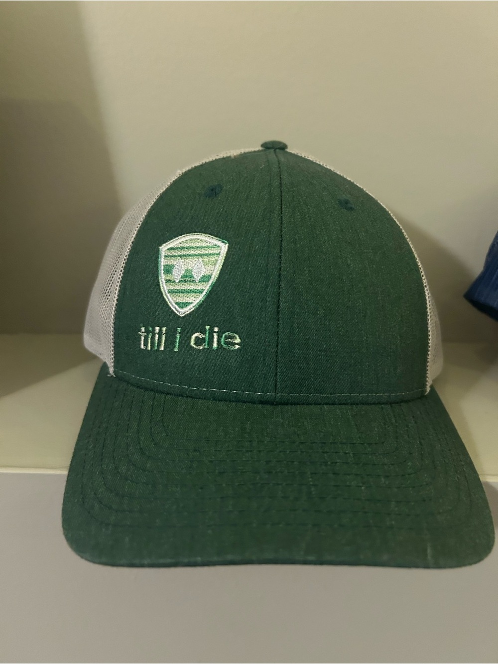 Green Trucker Hat with Embroidered Shield and 'till i die'